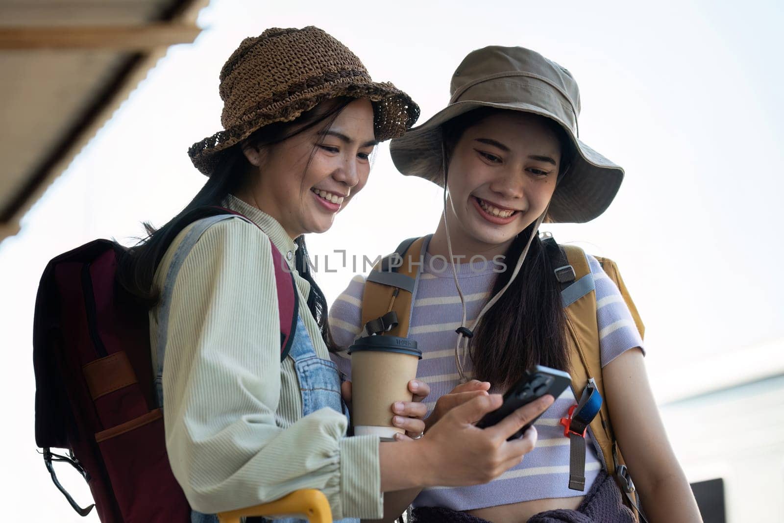 Woman using mobile phone while travel by train. travel concept.