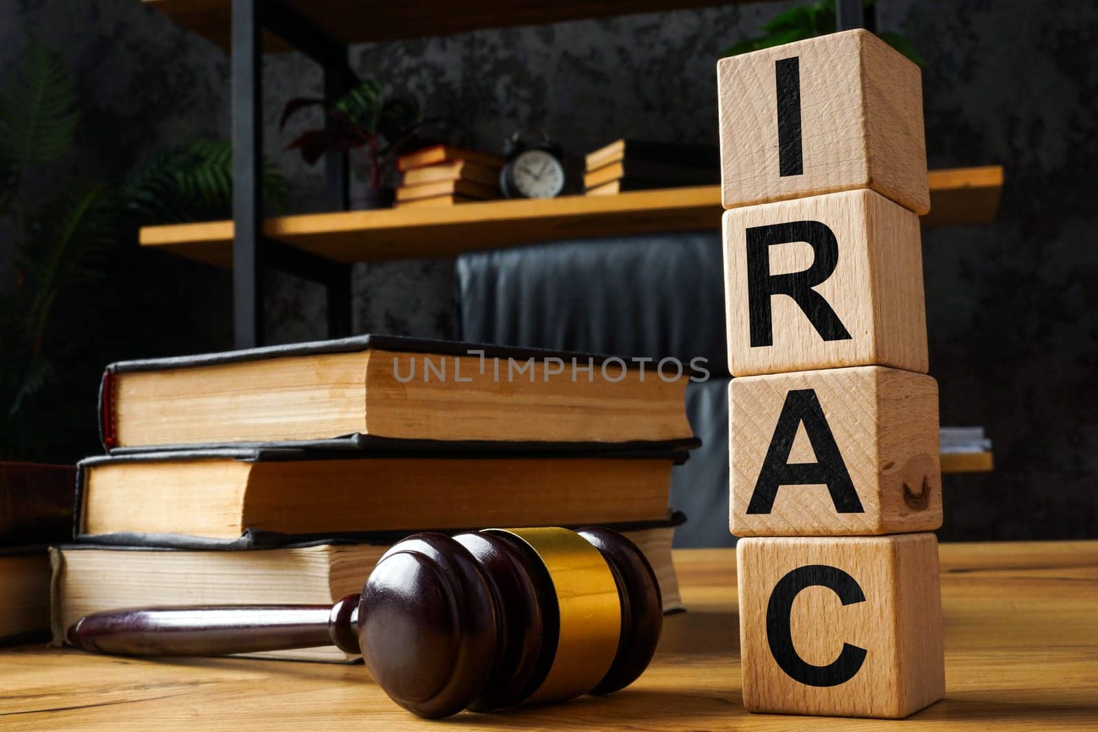Gavel and cubes with abbreviation IRAC Issue Rule Analysis Conclusion. by designer491