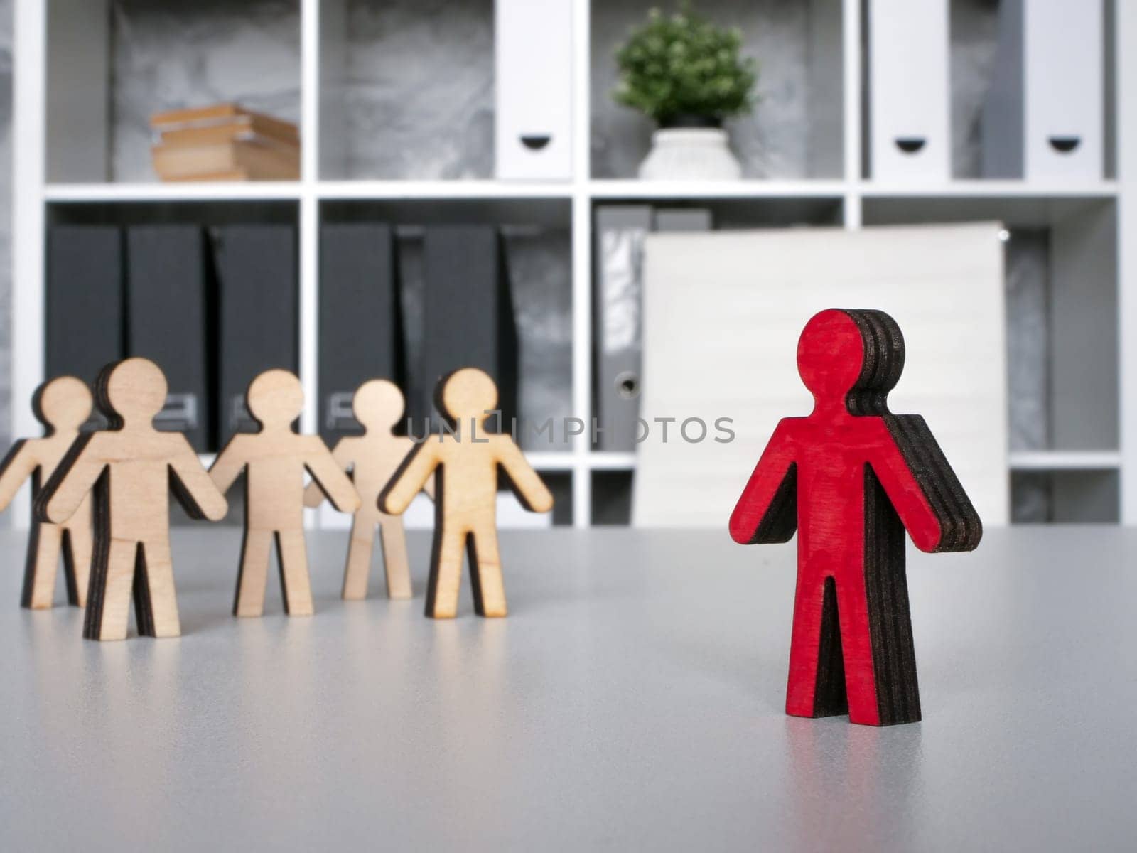 Figures on the office table and a leader. Personnel management. by designer491