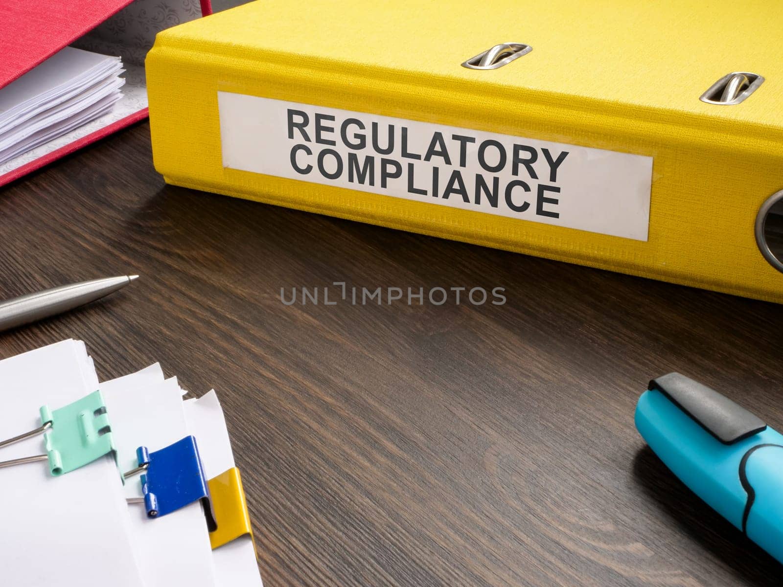 Folder with regulatory compliance and papers. by designer491