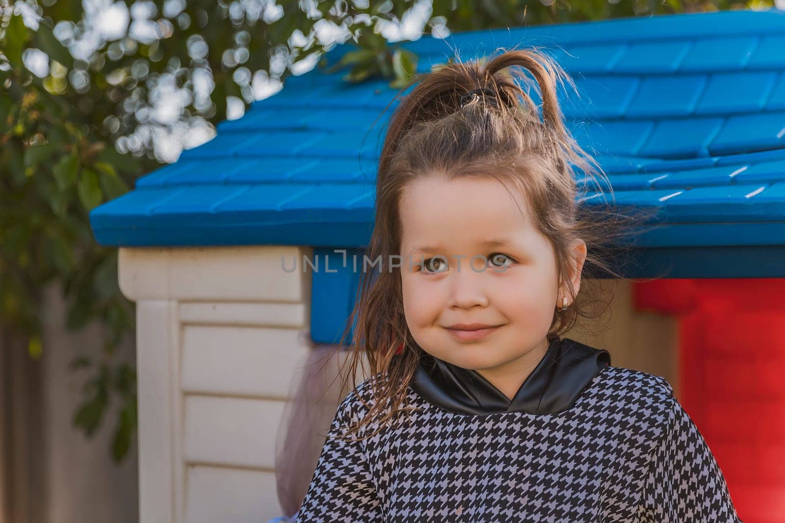 portrait of a little girl playing outdoors by zokov