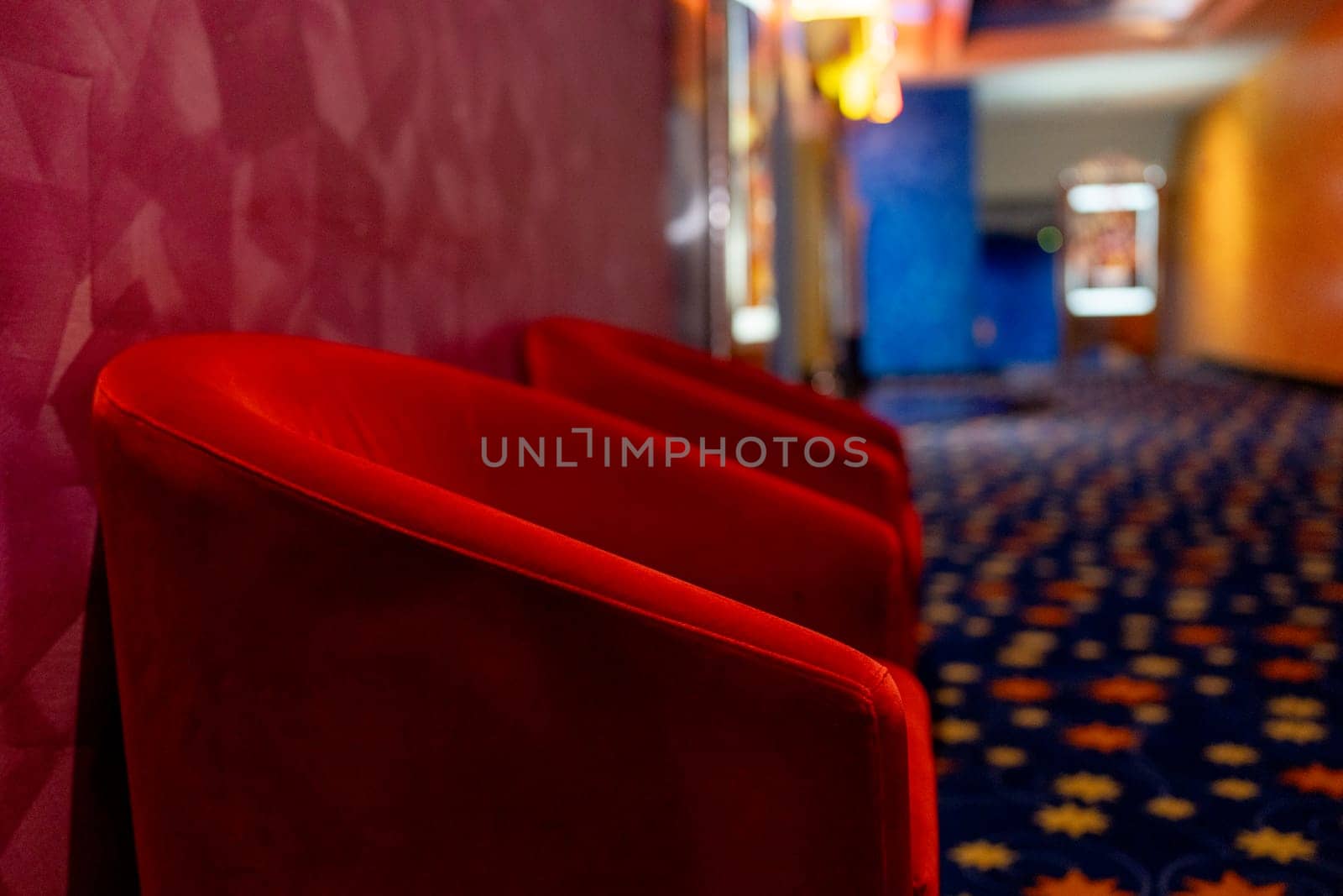 Side view area of in front gate of the movie theater with red chair. Concept of happy time for entertainment to relax on holiday.