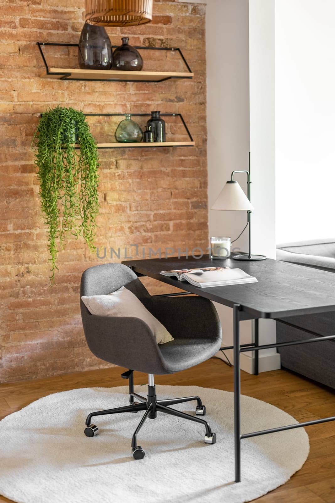 Design furniture bright work area at brick wall and pot-plant by apavlin