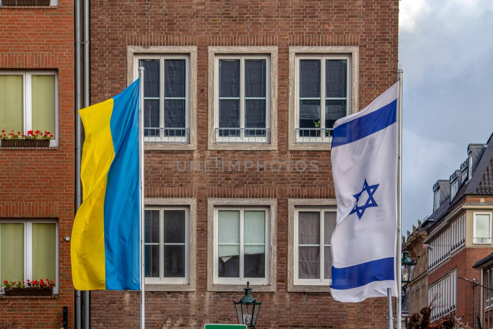 Ukraine and Israel flags flutter in the wind. High quality photo