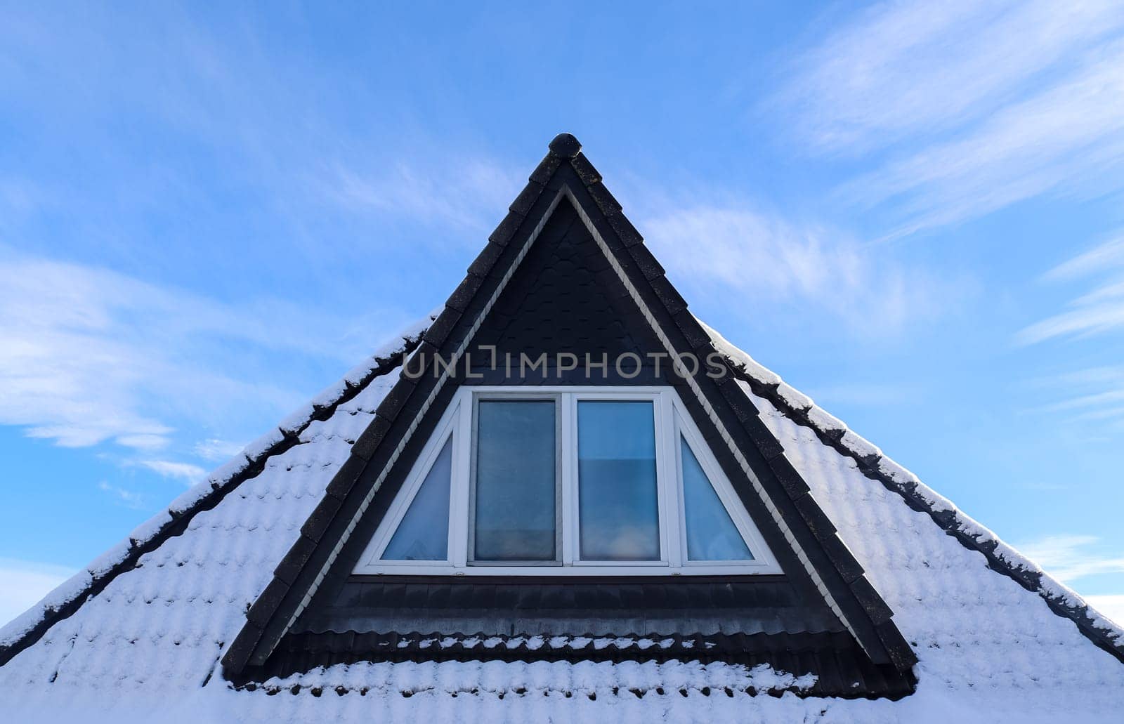 Roof window in velux style with black roof tiles by MP_foto71