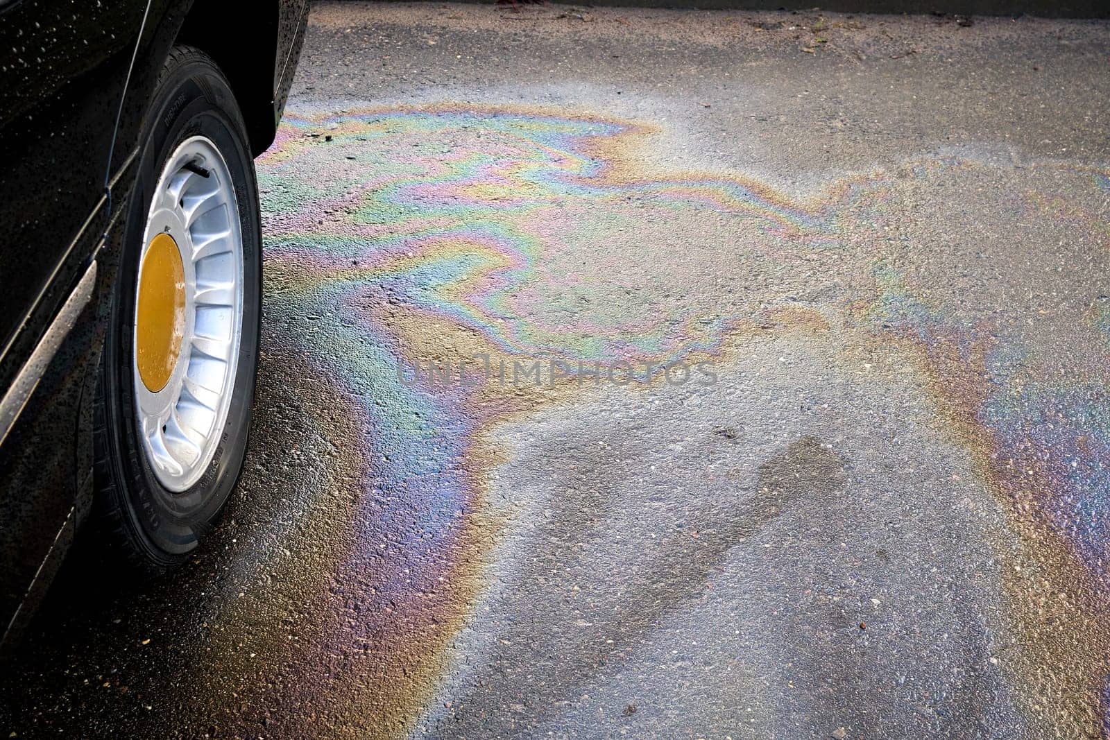 Engine oil stains of car. Leak under the car when the car is park.