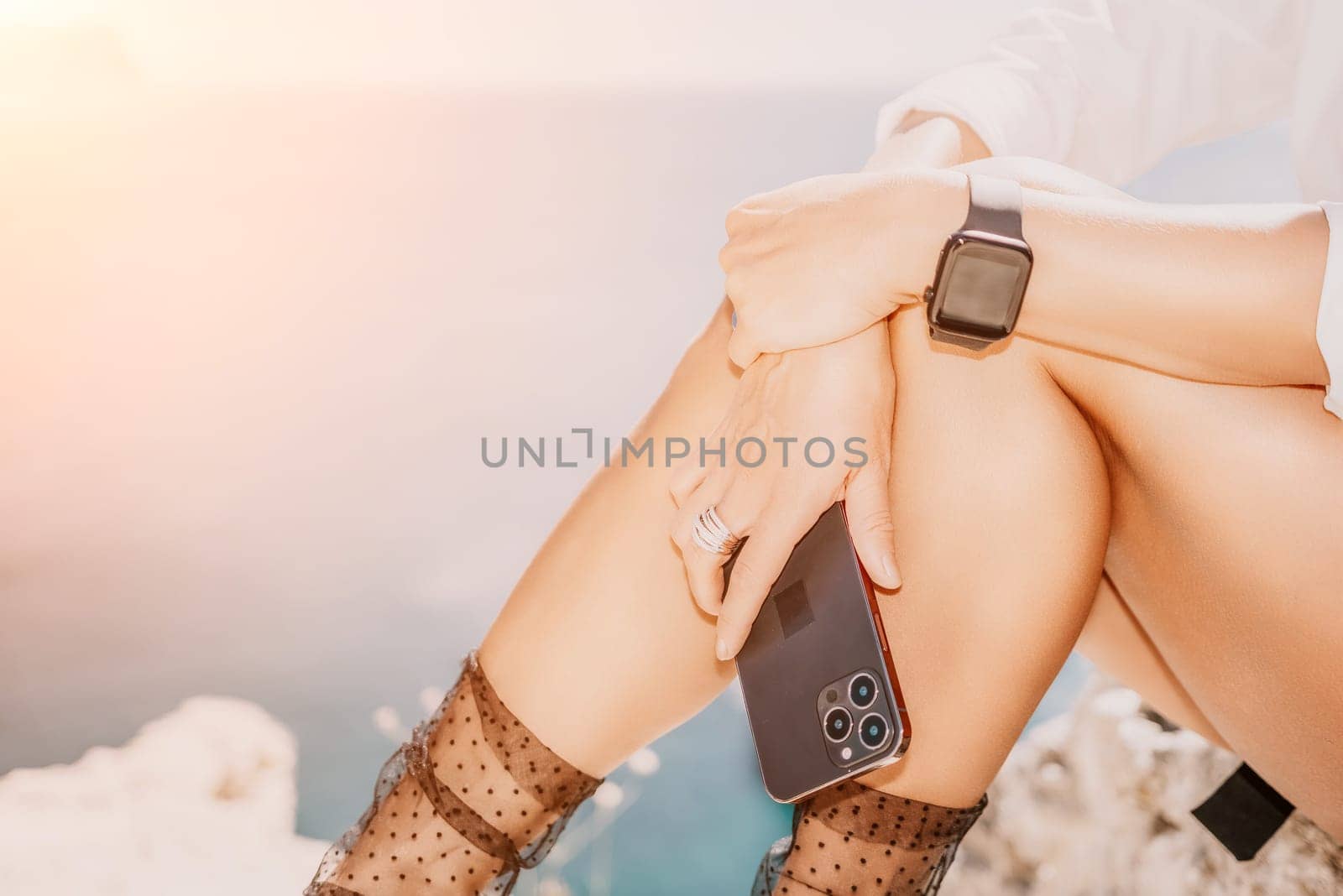 Woman sea laptop. Business woman in yellow hat freelancer with laptop working over blue sea beach. Girl relieves stress from work. Freelance, digital nomad, travel and holidays concept by panophotograph