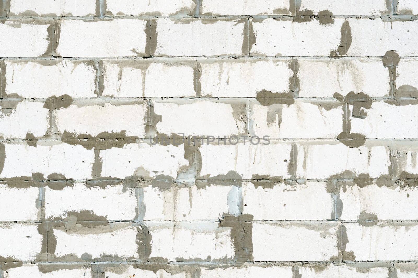 Textured Bricks, stone Background. The worn facade of the building
