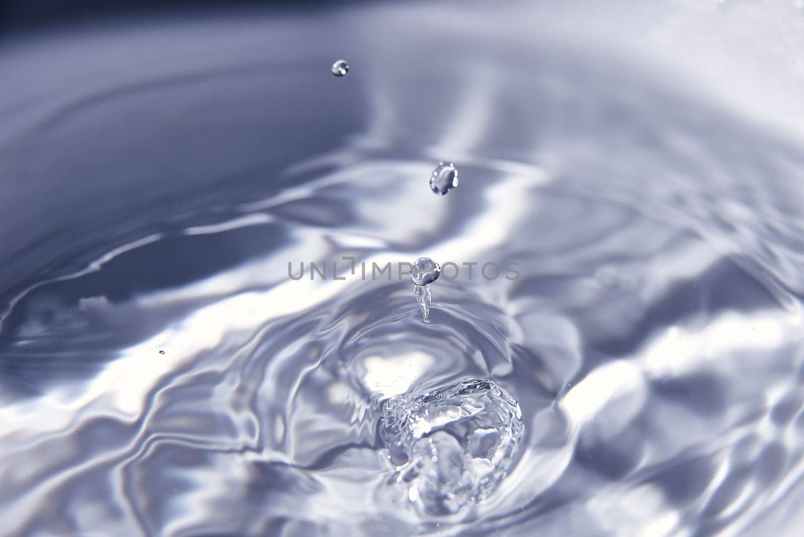 046.One or more drops of water splashing into waves and undefined shapes. Wallpaper by raul_ruiz