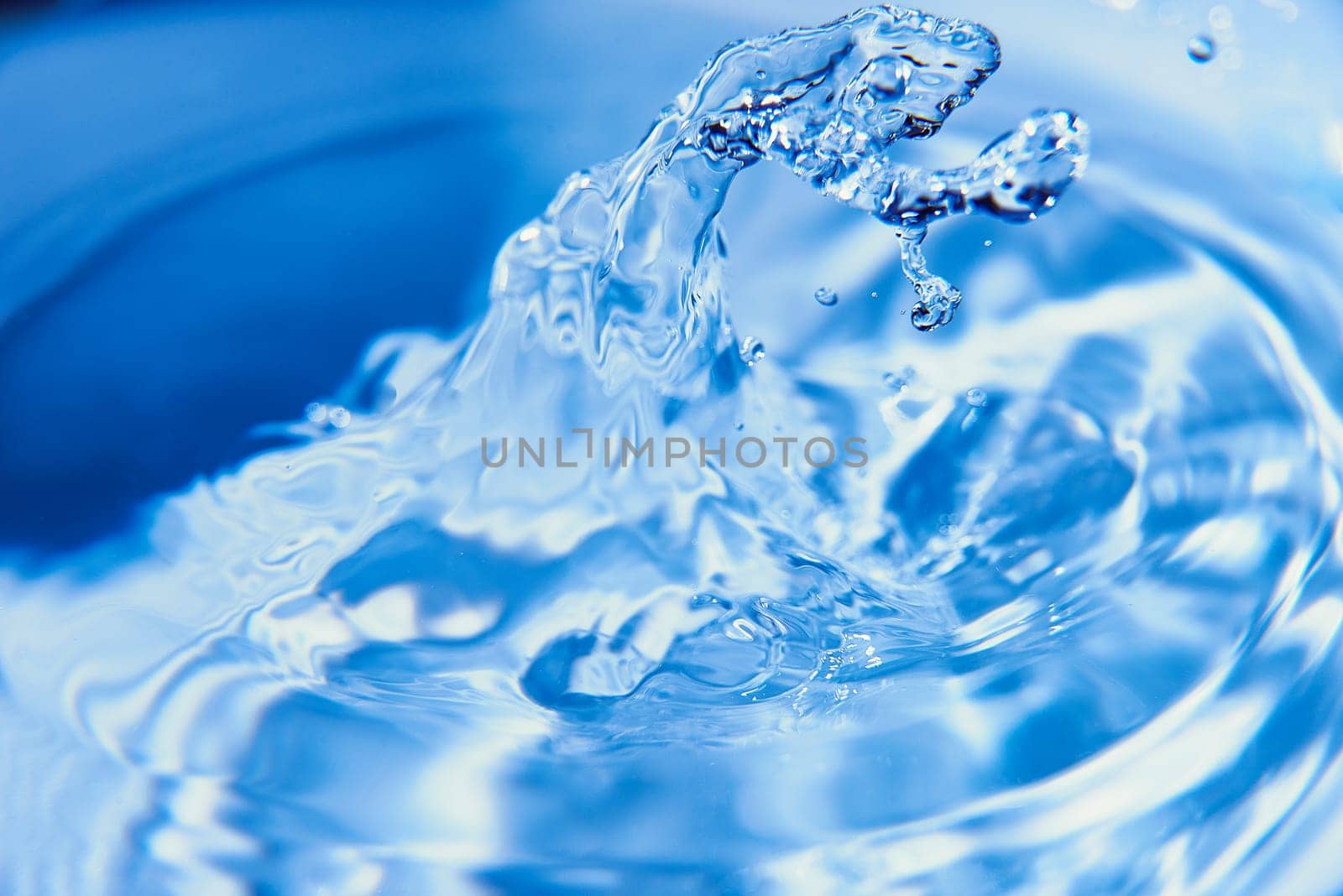053.One or more drops of water splashing into waves and undefined shapes. Wallpaper by raul_ruiz