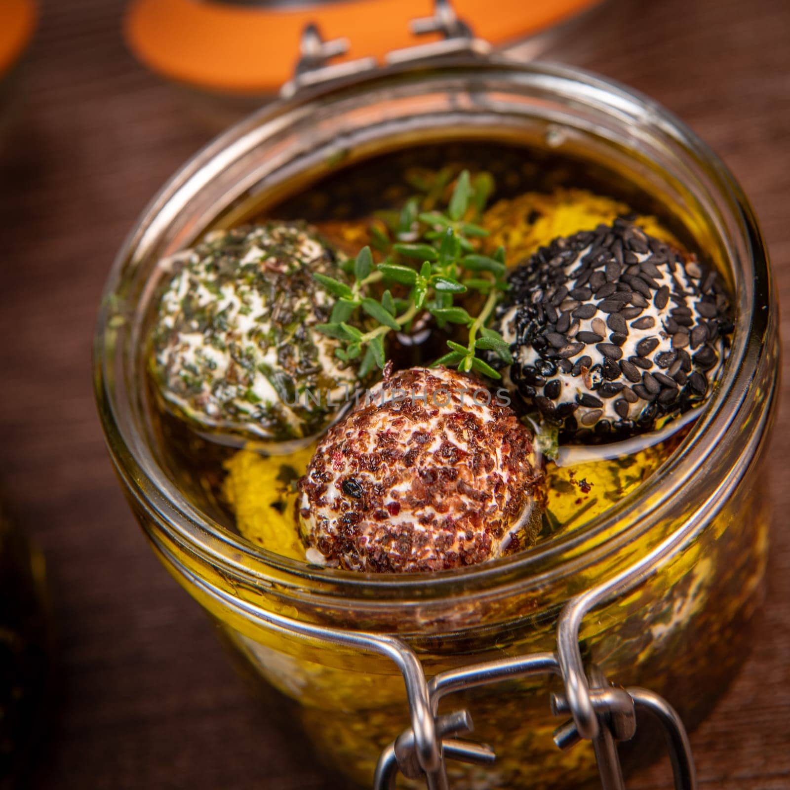RECIPE FOR LABNEH CHEESE BOLLS WITH DRY MINT, BLACK AND WHITE SESAME, SUMAC AND ZAATAR IN A JAR WITH OLIVE OIL. High quality photo