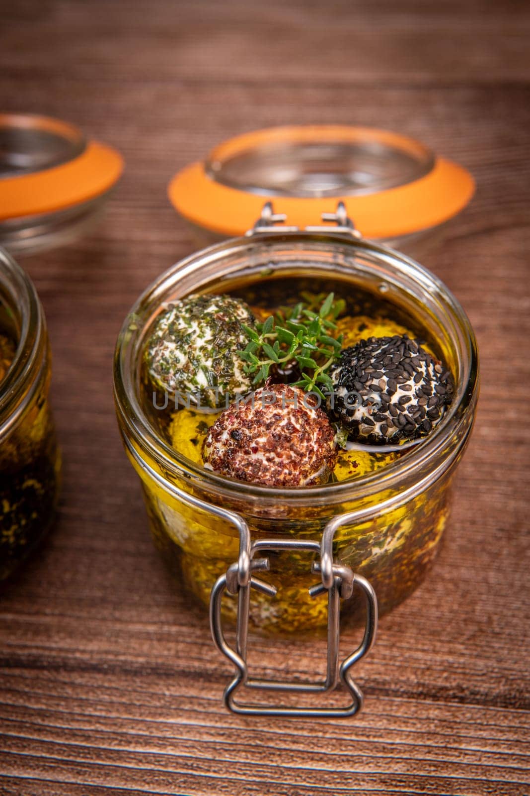 RECIPE FOR LABNEH CHEESE BOLLS WITH DRY MINT, BLACK AND WHITE SESAME, SUMAC AND ZAATAR IN A JAR WITH OLIVE OIL. High quality photo