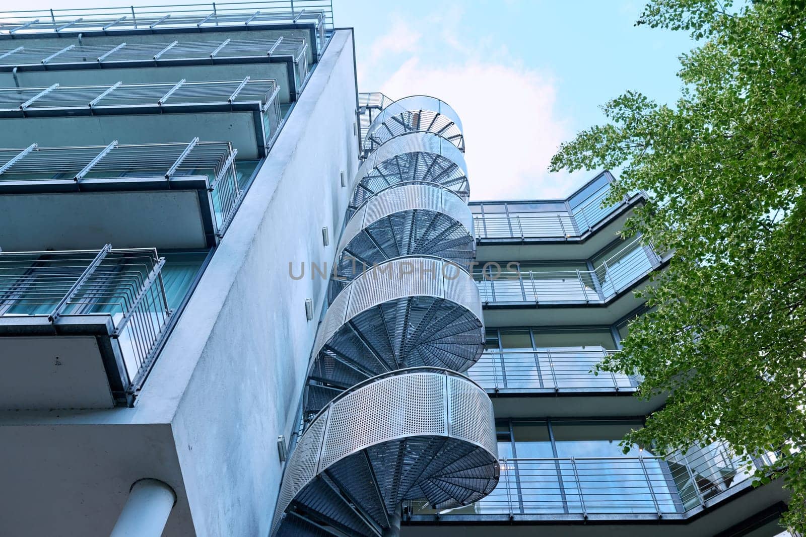 Hamburg, Germany, 1.08.2023, Exterior of a modern building, spiral steel circular staircase