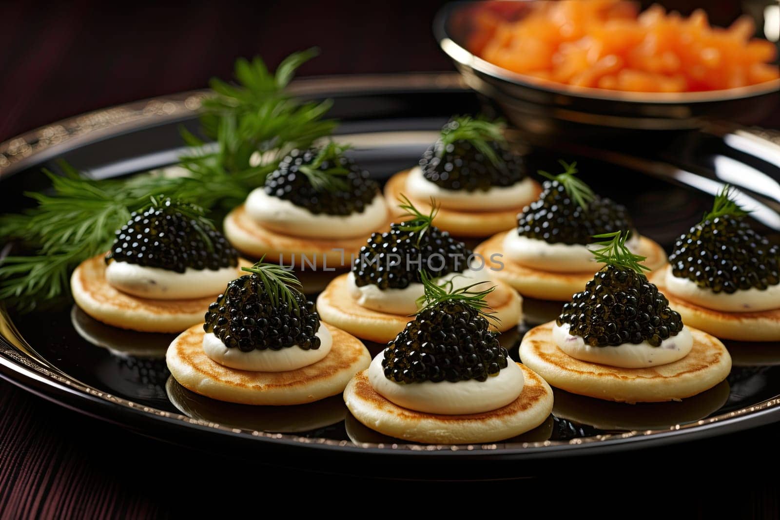 Beluga caviar on top of mini blinis. Gourmet food concept.
