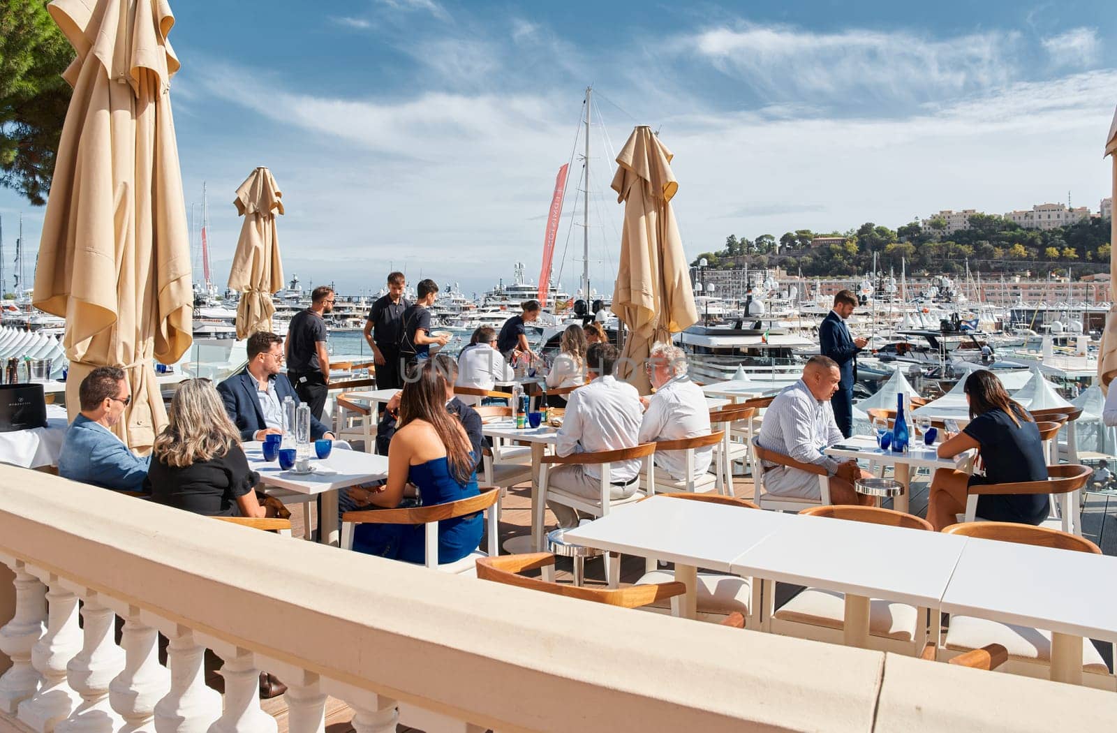 Monaco, Monte Carlo, 29 September 2022 - clients and yacht brokers look at the mega yachts presented, discuss the novelties of the boating industry at the famous motorboat exhibition. High quality photo