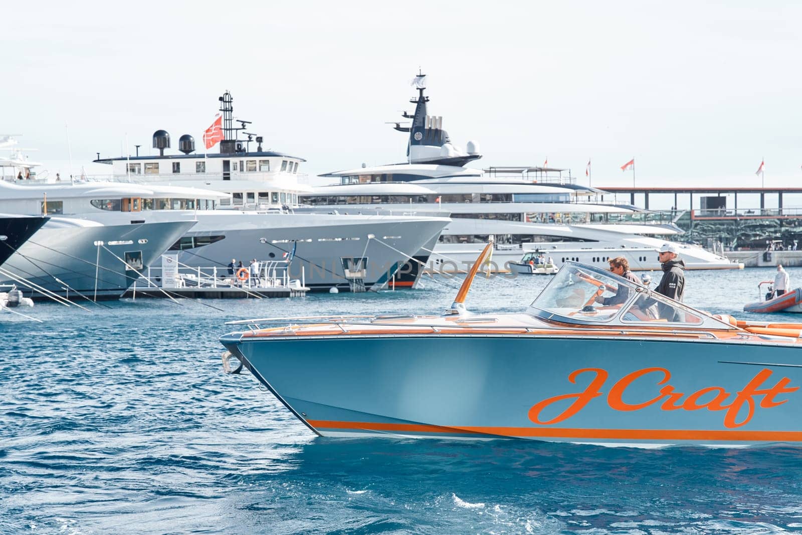 Monaco, Monte Carlo, 29 September 2022 - Water taxi by luxury motorboat on the famous yacht exhibition, a lot of most expensive luxury yachts, richest people, yacht brokers, boat traffic by vladimirdrozdin