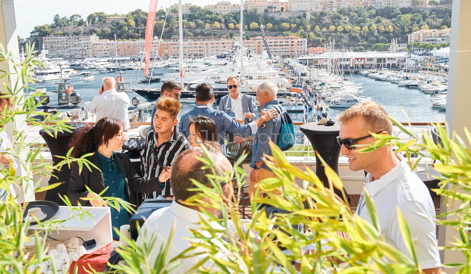 Monaco, Monte Carlo, 29 September 2022 - a lot of people, clients and yacht brokers look at the mega yachts presented, discuss the novelties of the boating industry at the famous motorboat exhibition. High quality photo