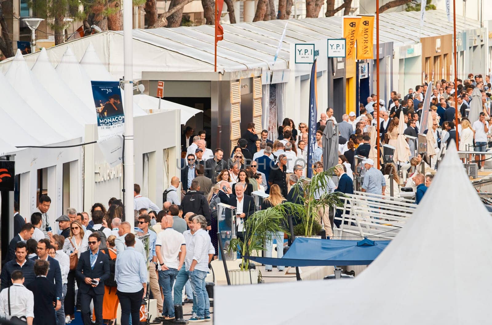 Monaco, Monte Carlo, 29 September 2022 - The famous motorboat exhibition, mega yacht show, clients and yacht brokers discuss the novelties of the boating industry, look at the mega yachts presented. High quality photo