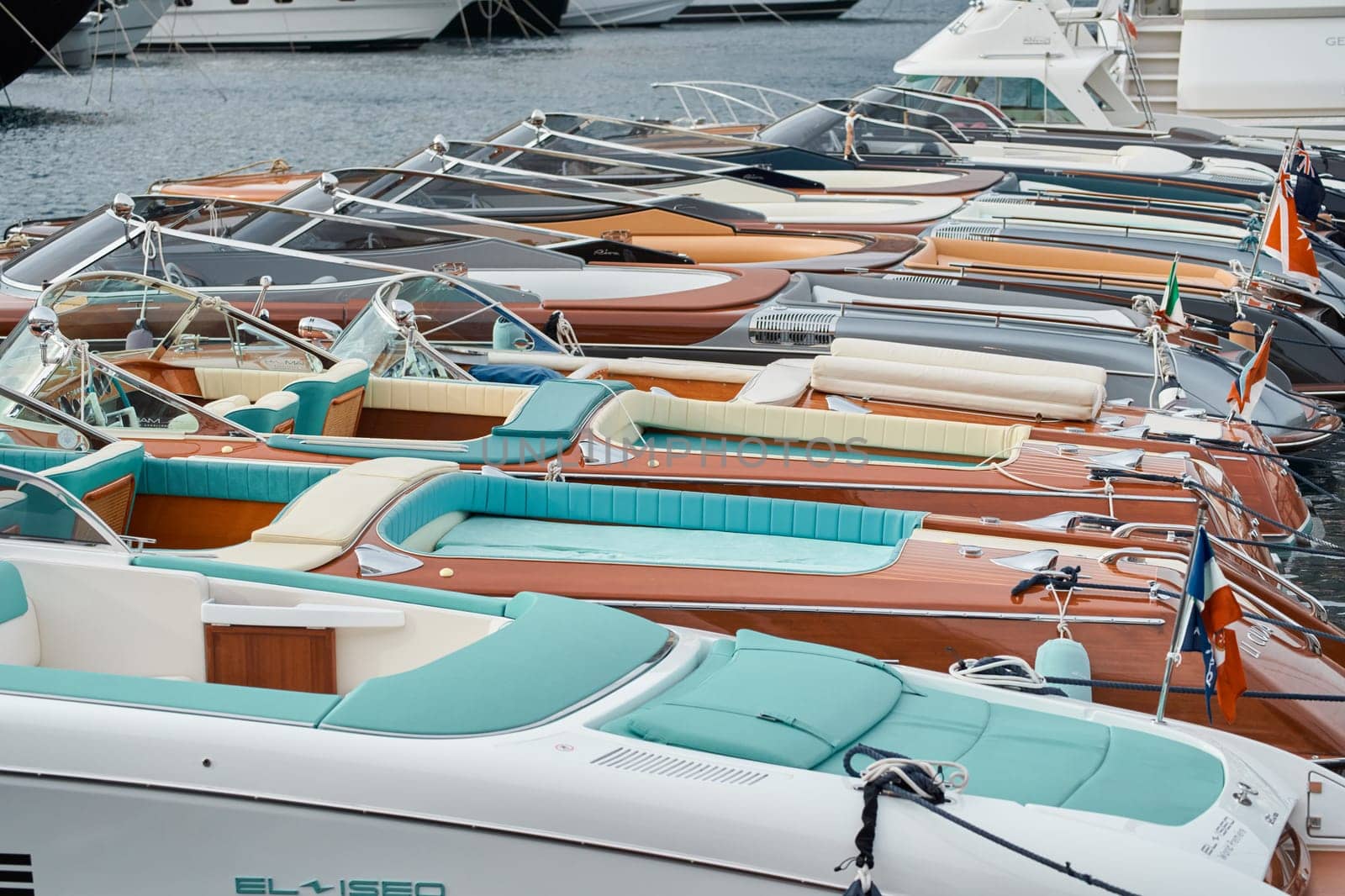 Monaco, Monte Carlo, 29 September 2022 - Few luxury retro motorboats Riva in a row at the famous motorboat exhibition in the principality, elegance boats for rich clients by vladimirdrozdin