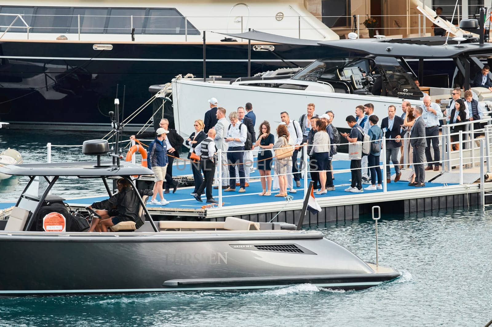 Monaco, Monte Carlo, 29 September 2022 - Water taxi by luxury motorboat on the famous yacht exhibition, a lot of most expensive luxury yachts, richest people, yacht brokers, boat traffic. High quality photo