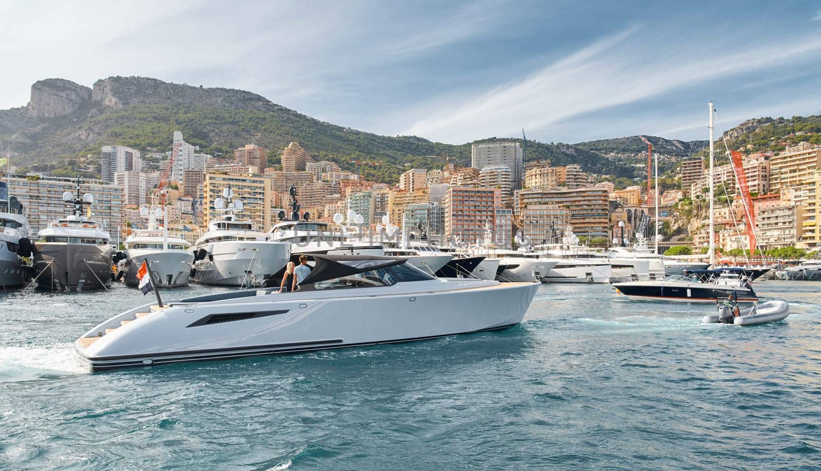 Monaco, Monte Carlo, 29 September 2022 - Water taxi by luxury motorboat on the famous yacht exhibition, a lot of most expensive luxury yachts, richest people, yacht brokers, boat traffic by vladimirdrozdin