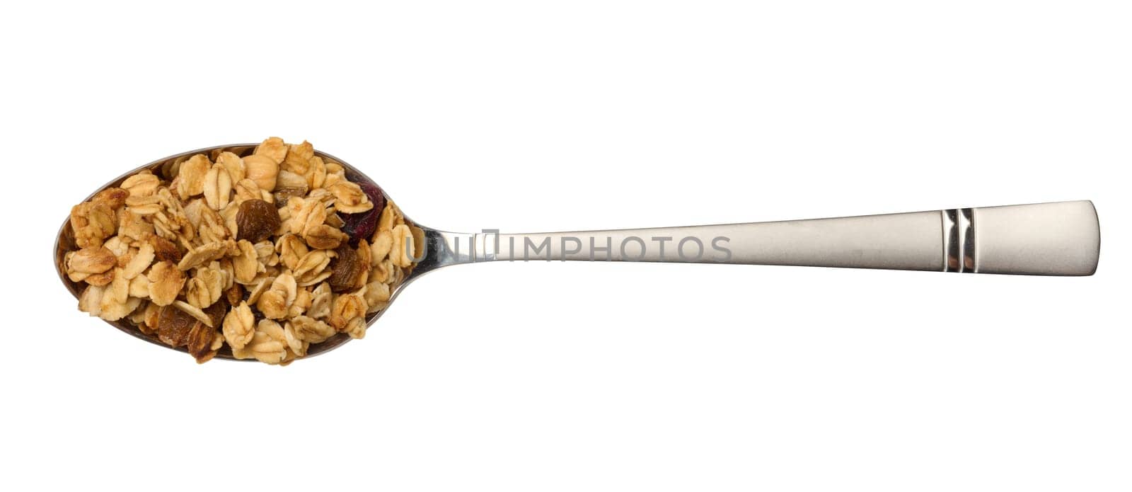 Oatmeal, raisins, cashews and almonds. Granola in metal spoon by ndanko