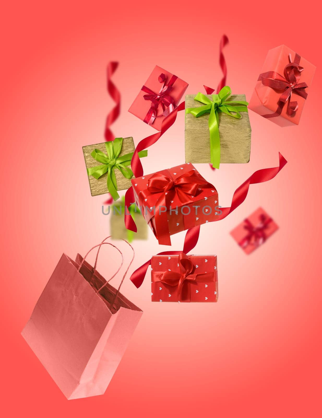 Levitating gifts in a craft bag on a red background, holiday