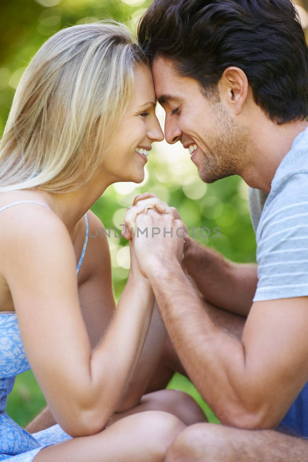 Romance, love or happy couple holding hands in nature for date, support or care on a summer in park together. Relax, man or woman on outdoor holiday vacation for bond, travel or freedom in Australia.