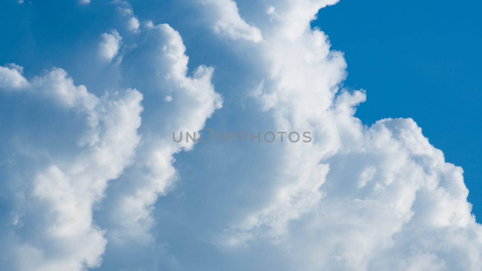 Blue sky background with tiny clouds and space for text.