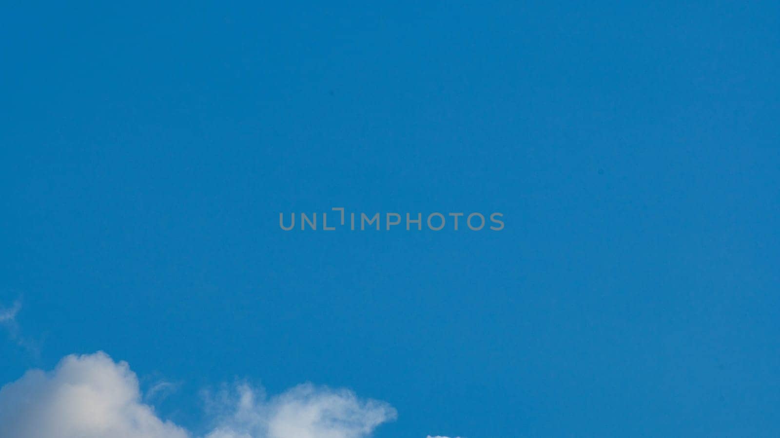 Blue sky background with tiny clouds and space for text. by TEERASAK