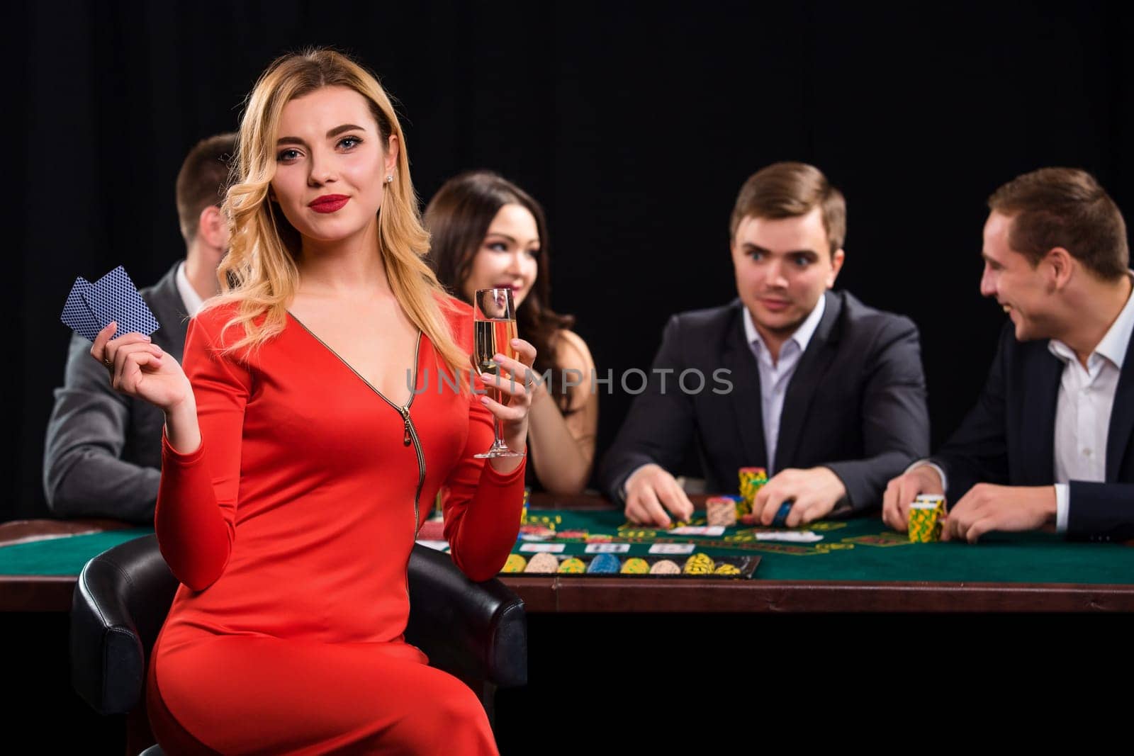 Young people playing poker at the table. Casino by nazarovsergey