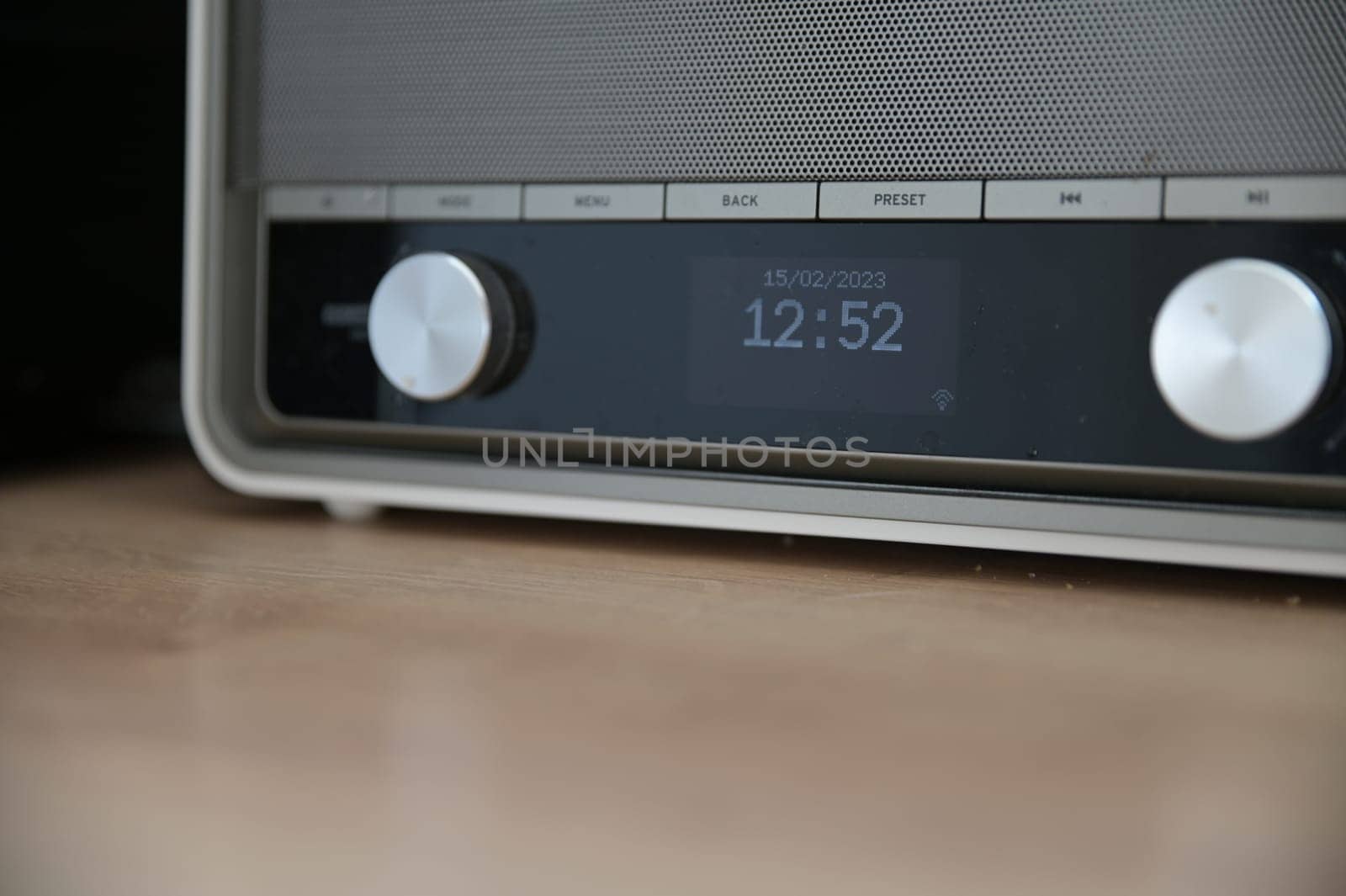 Beige retro kitchen radio with time on the LCD display by rherrmannde