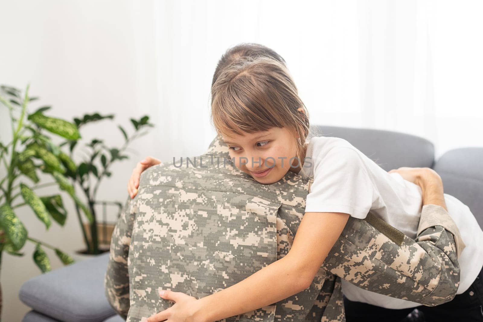 Military dad hugging his daughter. High quality photo