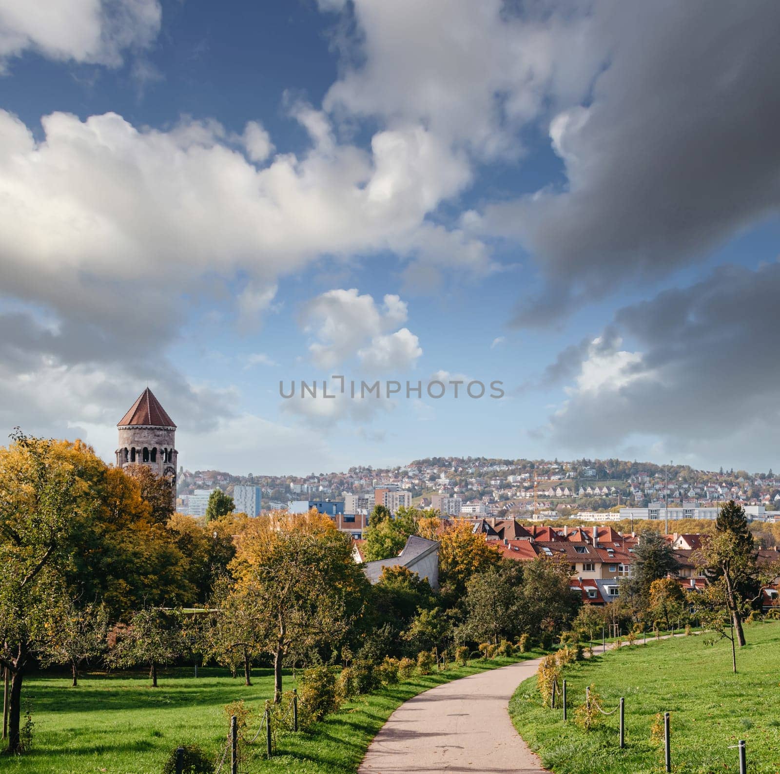 Germany, Stuttgart panorama view. Beautiful houses in autumn, Sky and nature landscape. Vineyards in Stuttgart - colorful wine growing region in the south of Germany with view over Neckar Valley. Germany, Stuttgart city panorama view above vineyards, industry, houses, streets, stadium and highway at sunset in warm orange light.