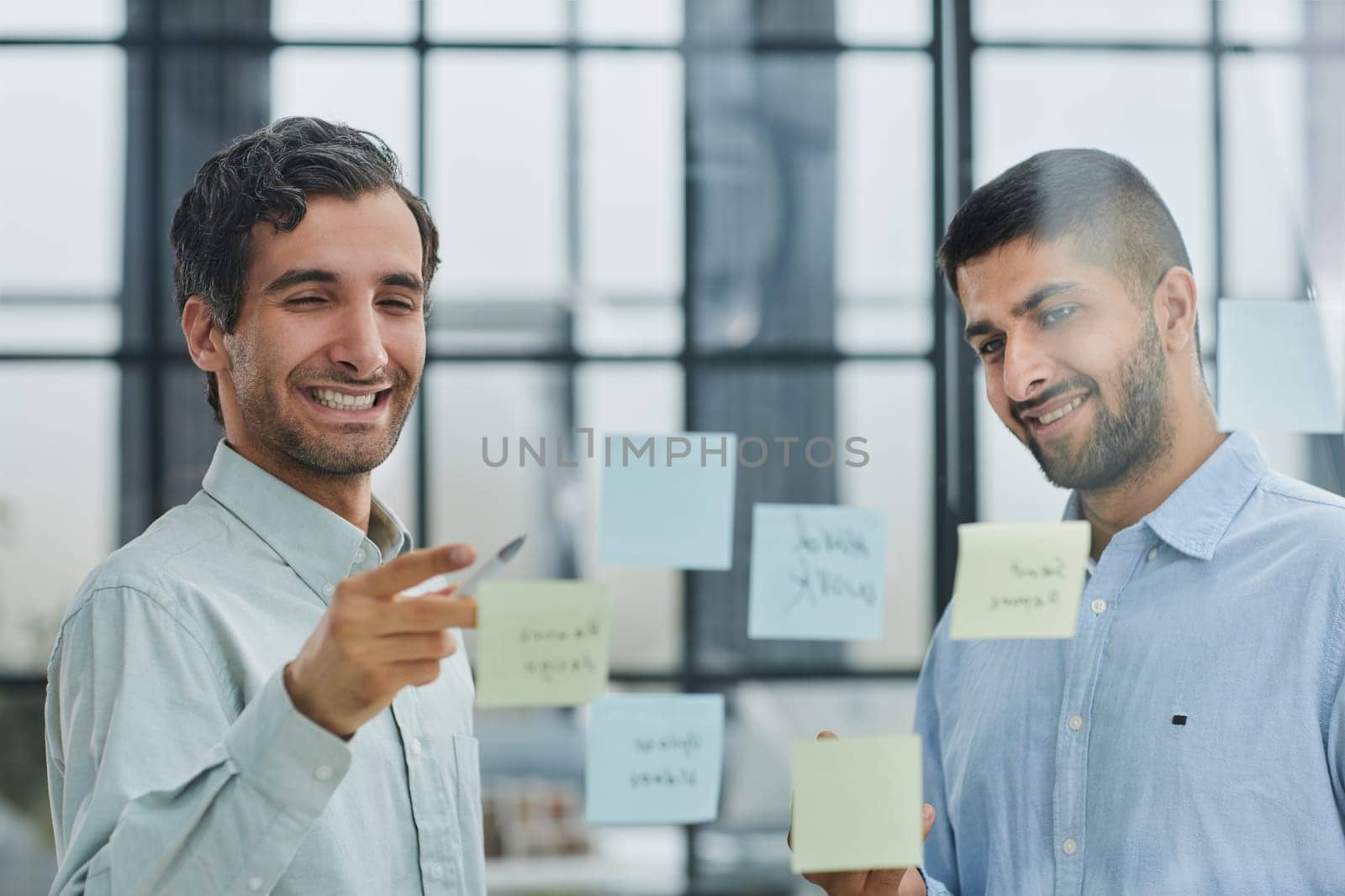 two successful businessmen in the office discuss a plan on stickers by Prosto