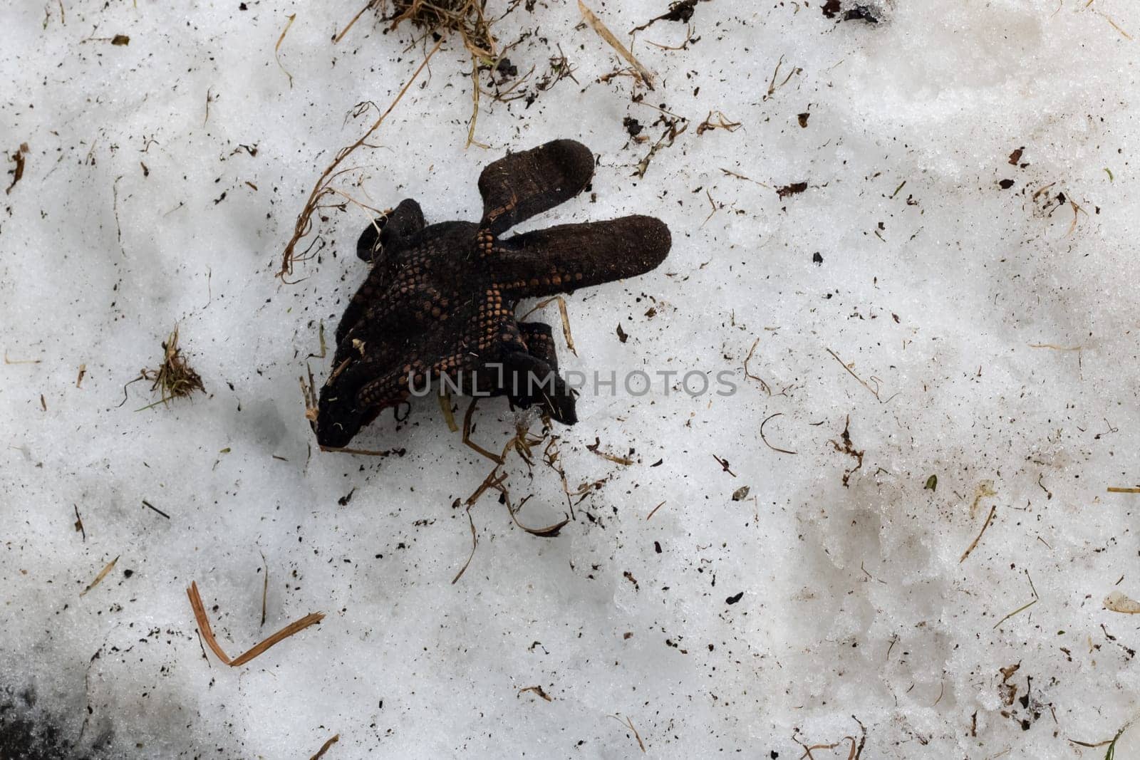 Dirty glove on the snow close up, copy space