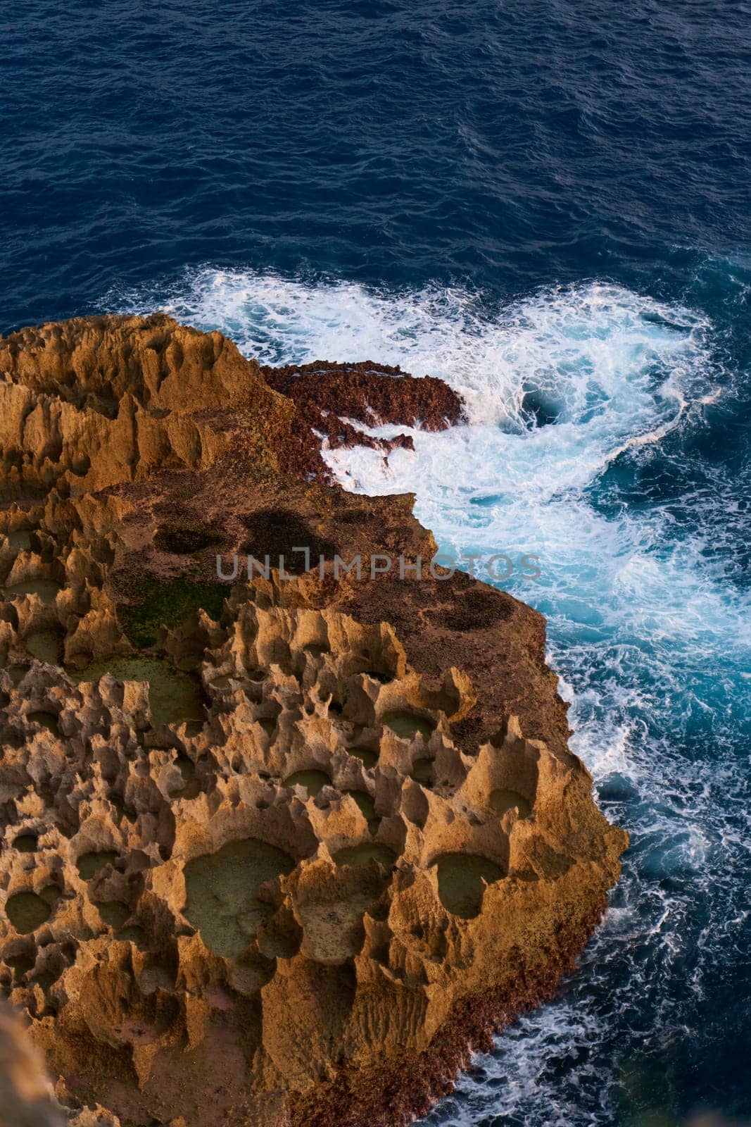 Cinematic aerial landscape shots of the beautiful island of Nusa Penida. Huge cliffs by the shoreline and hidden dream beaches with clear water and foaming wave. by Try_my_best