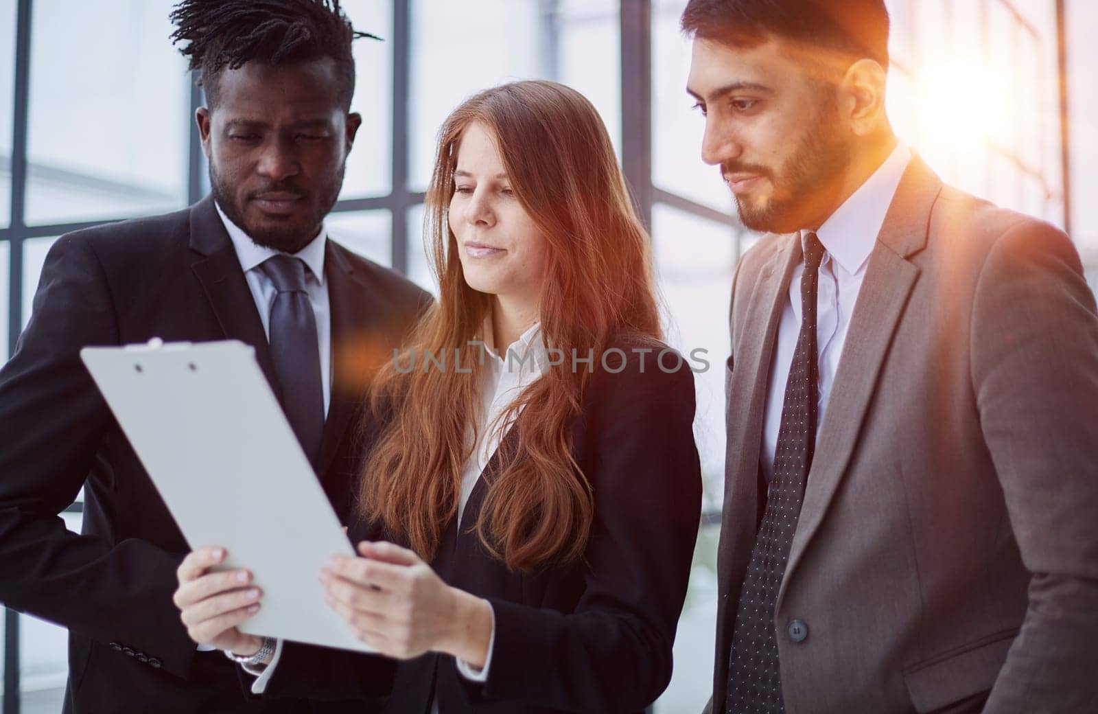 Young businesspeople working together at office corridor,