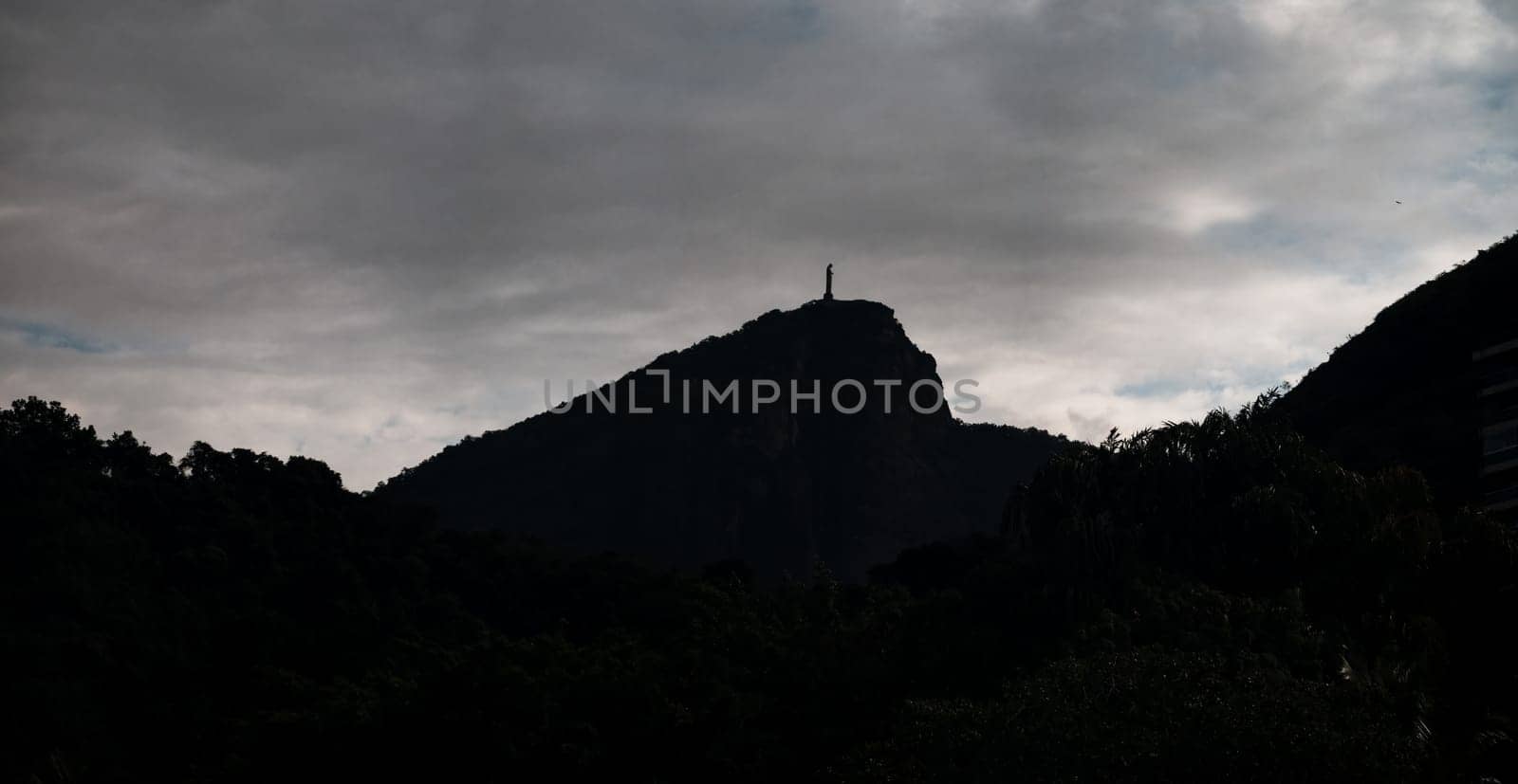 Silhouette of Christ the Redeemer Statue Against Twilight Sky by FerradalFCG