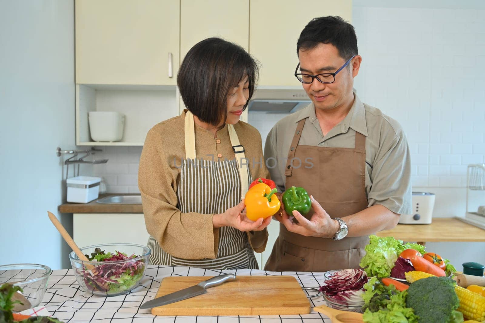 Shot of a happy senior couple making a healthy vegetarian meal in the kitchen. Healthy lifestyle concept