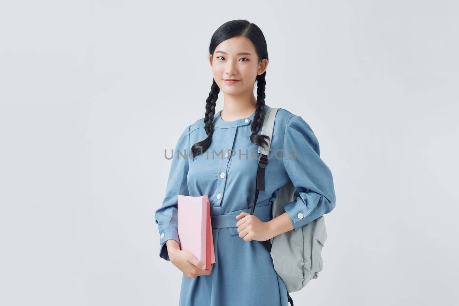  Portrait of female student with books