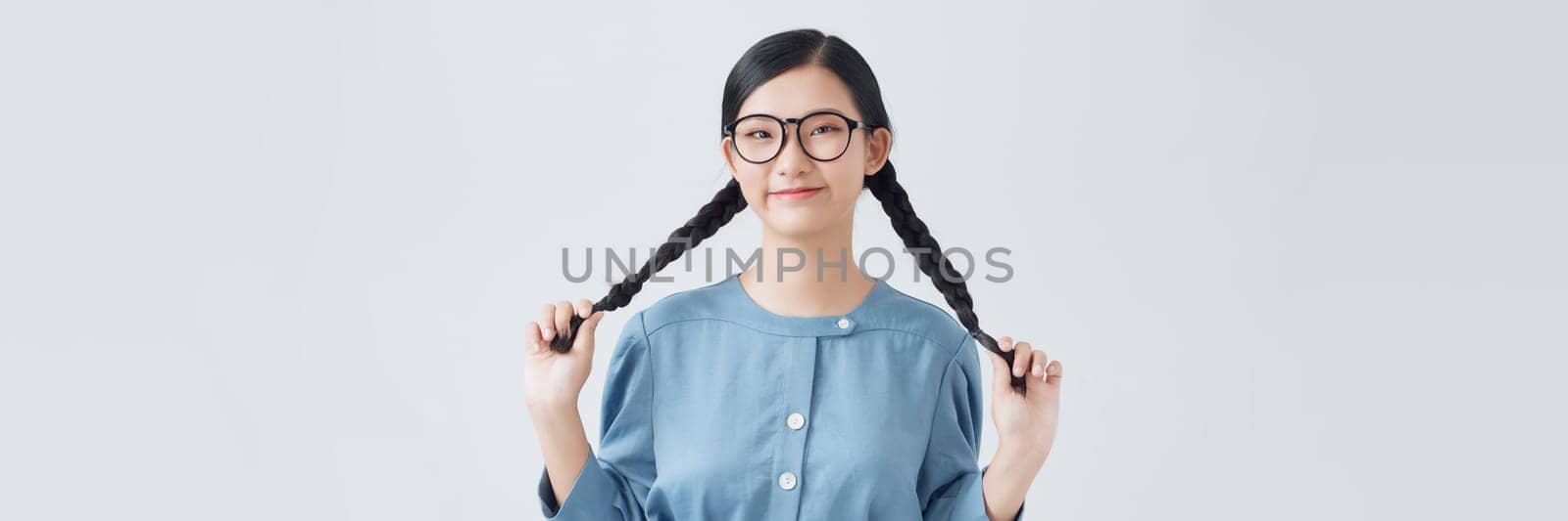 young Asian woman wearing blue dress on white background by makidotvn