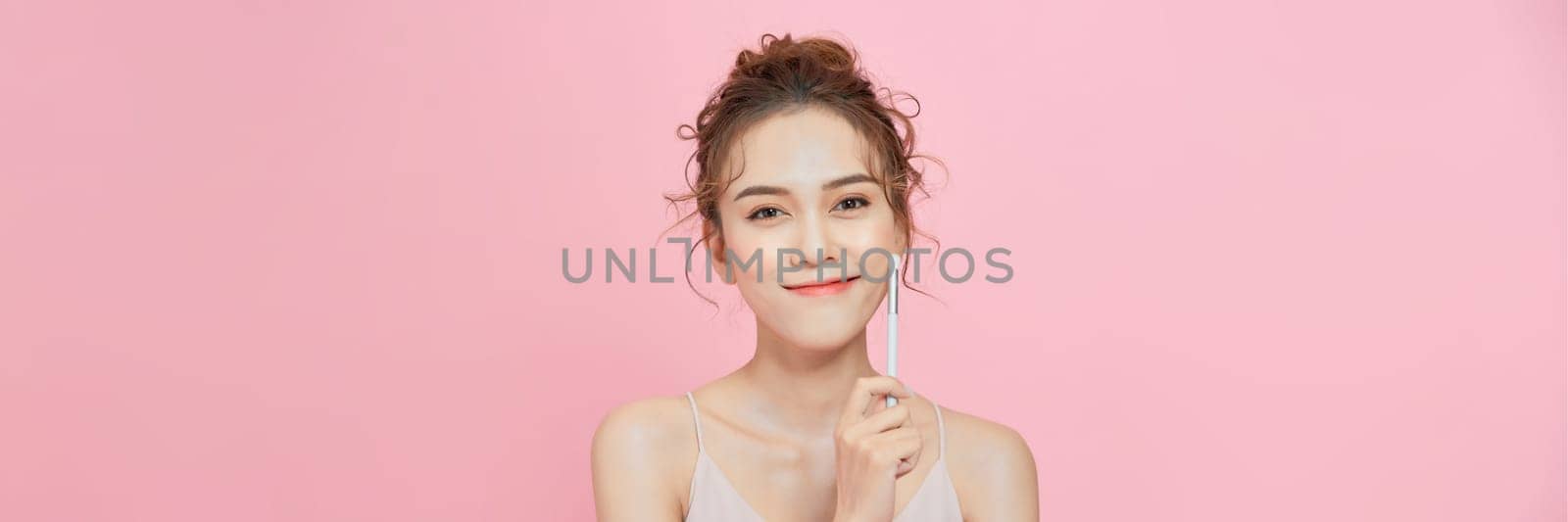 Girl with makeup brushes near face by makidotvn