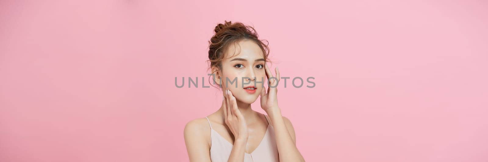  Beautiful face of young adult woman with clean fresh skin