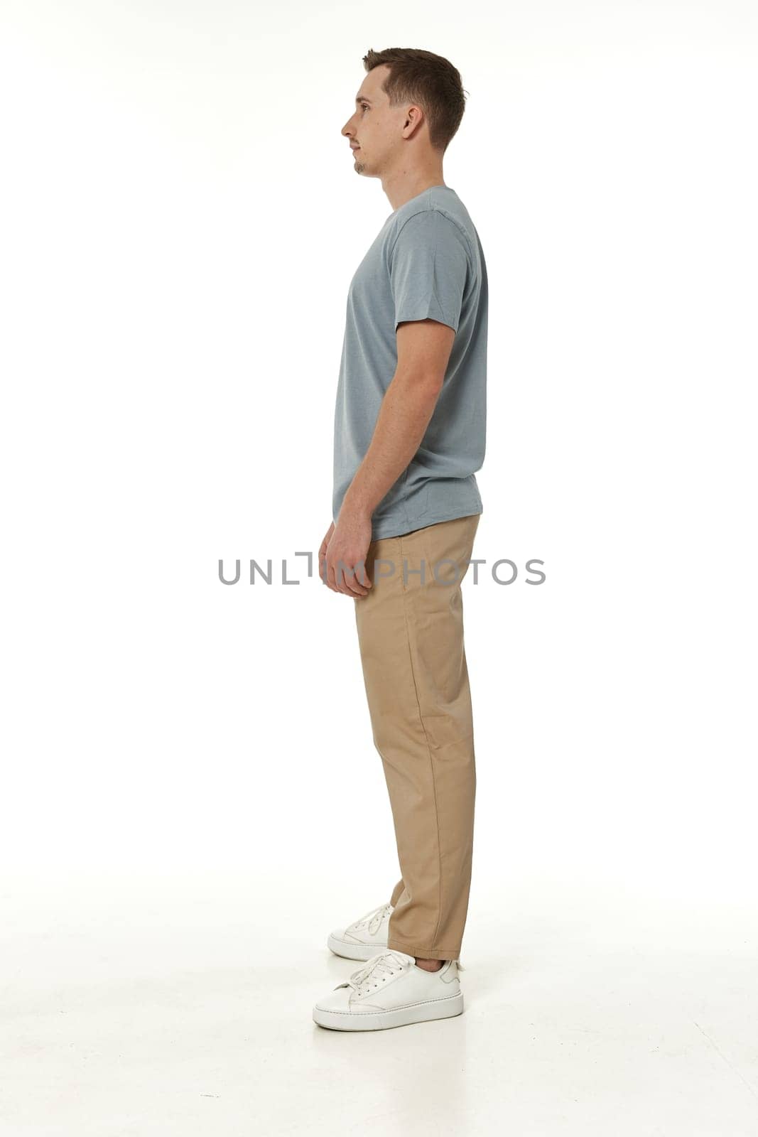 handsome young calm man on white background