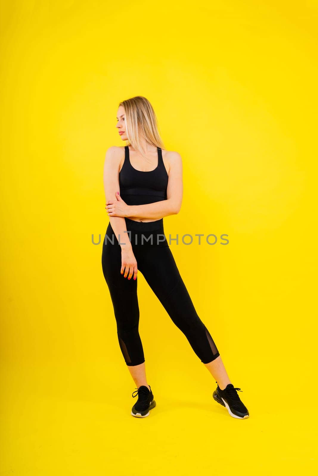 Young strong sporty athletic fitness trainer instructor woman. Workout sport conception