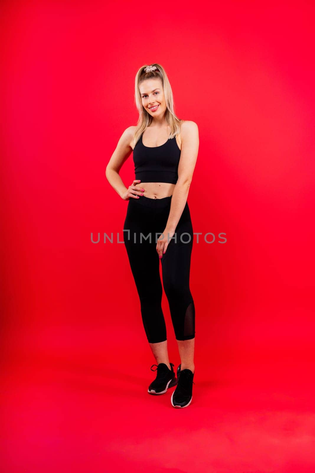 Young strong sporty athletic fitness trainer instructor woman. Workout sport conception