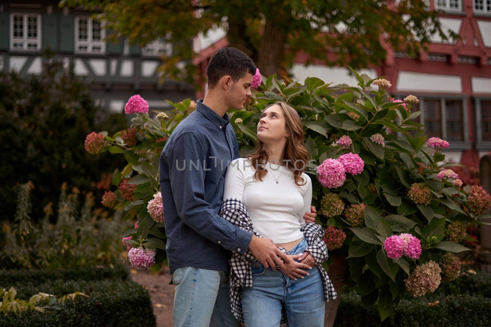 Young Cute Female Hugs Boyfriend. In Autumn Outdoor. Lovers Walking in Park. Attractive Funny Couple. Lovestory in Forest. Man and Woman. Cute Lovers in the Park. Family Concept. Happy Couple.