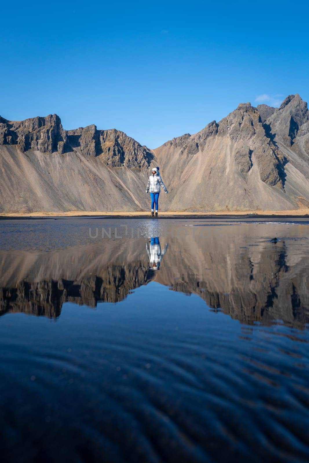 Woman posing on Stokksnes beach, Iceland