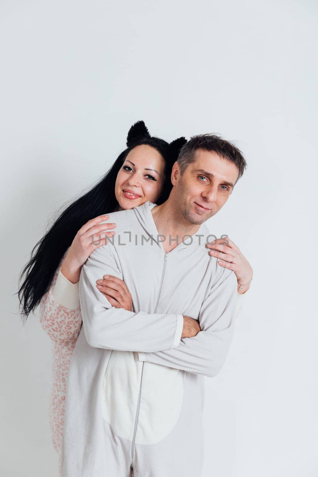 Husband and wife Man and woman in pajamas in the morning in a bright room